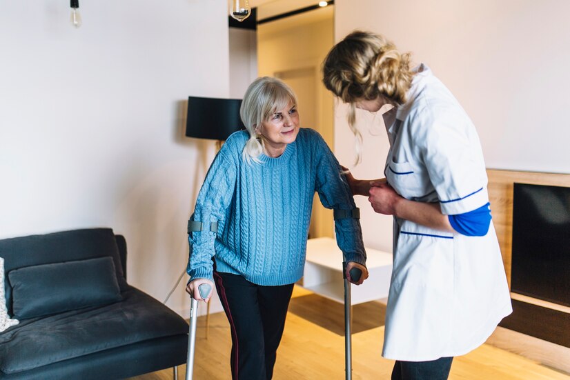 Healthcare Responder Assisting Elderly Woman in Her Home